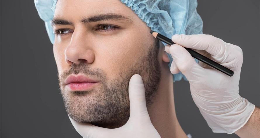 doctor-drawing-lines-for-facelifting-on-man-isola-2024-11-19-11-55-45-utc