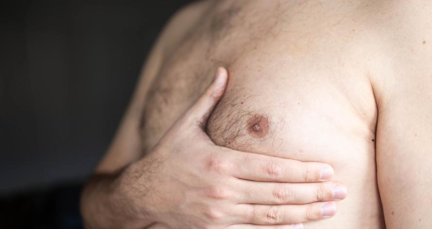 man-checking-his-chest-for-lumps-2025-01-09-18-37-57-utc
