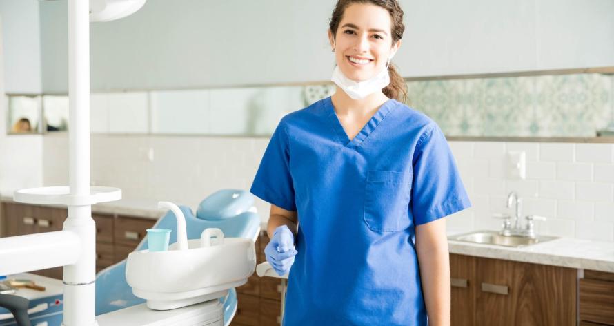 portrait-of-smiling-dentist-in-scrubs-at-clinic-2025-06-30-20-49-25-utc