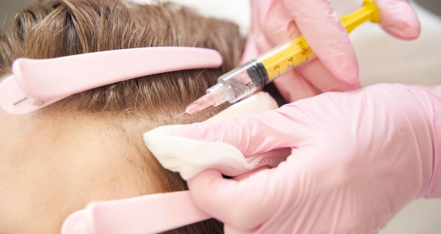 syringe-with-injection-pricking-forehead-during-be-2025-03-09-10-12-28-utc